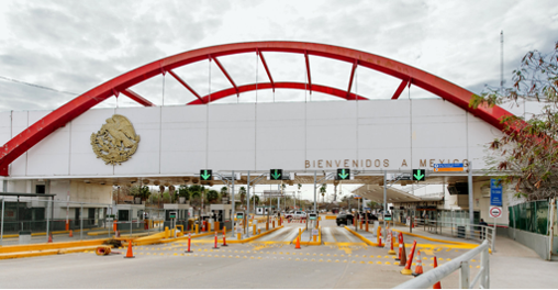 Mexico border with red bridge sculpture car entry lanes