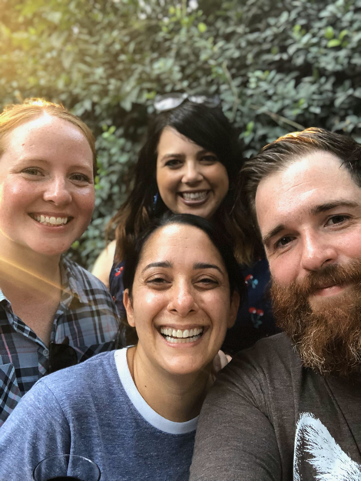 Colin smile for a photo with his wife their Austin friends