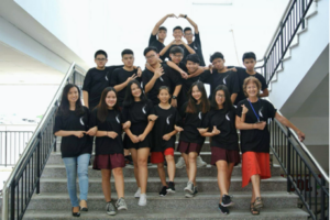 large group of people pose on stairs