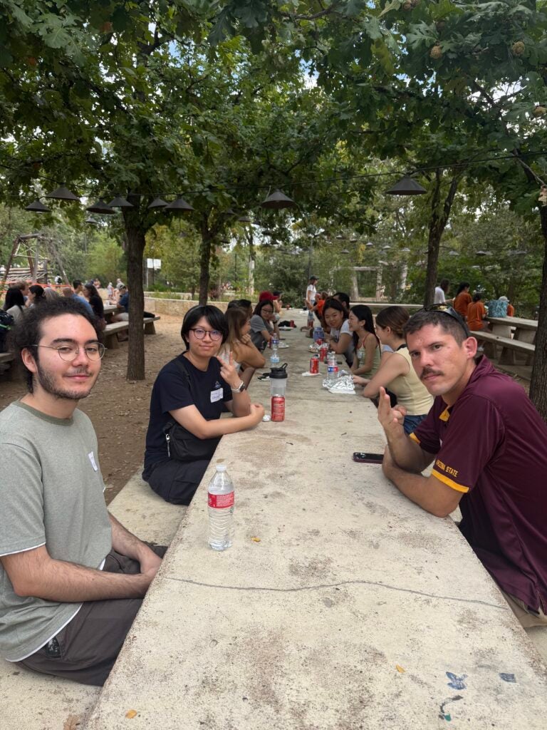 Group sitting together along table