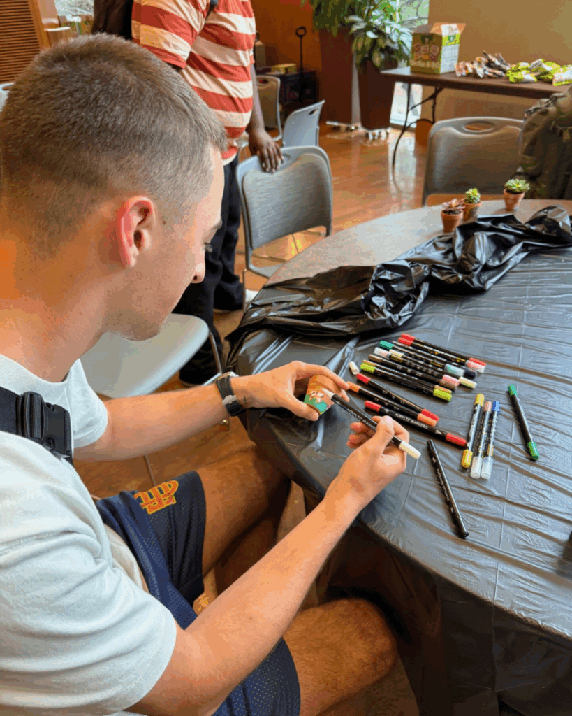 Student looking through markers