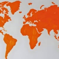 Colorful World Map Design in Vibrant Orange Hues on a Clean White Background